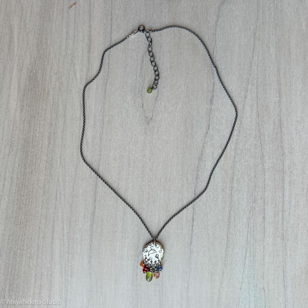 il_fullxfull.7206198227_k5rv.jpg Written in Stars - Leo - Zodiac Seal Peridot Garnet Sterling Silver Necklace